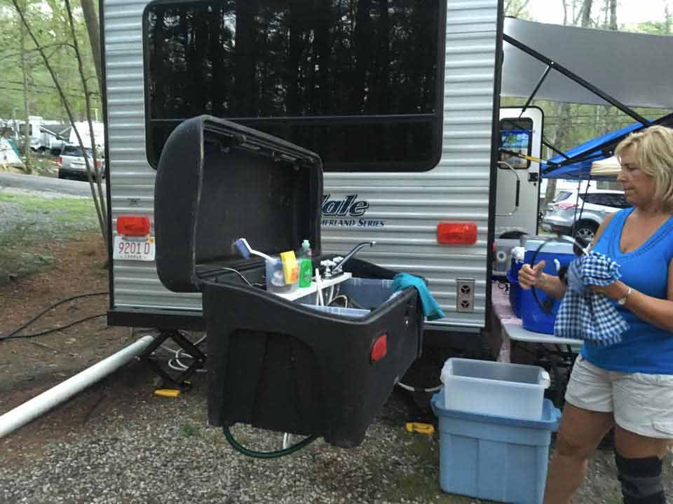 StowAway Standard Cargo Carrier converted into camping sink to wash dishes