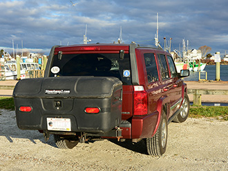 StowAway Standard Cargo Carrier on Jeep Grand Cherokee, parked at marina