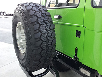 StowAway SwingAway Frame carring spare tire on Hummer H1