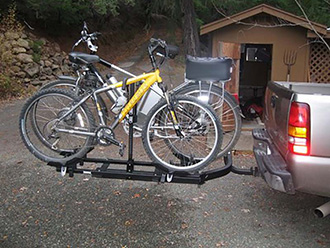 StowAway SwingAway Frame on Chevy Silverado with Thule wheel-mounted bike rack, 2 bikes, SwingAway closed