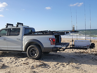 Ford pickup truck with StowAway Surf Fishing Rod Rack, tailgate open