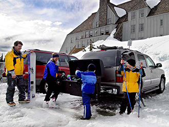 Family unloading GMC Yukon with StowAway Standard Cargo Carrier at Timberline Lodge, Mt. Hood, Oregon