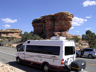 Leisure Travel Sprinter van with StowAway MAX Cargo Carrier driving in Canyonland National Park, Utah