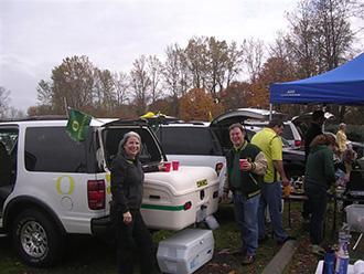 Oregon Ducks fans tailgating with white StowAway MAX Cargo Carrier