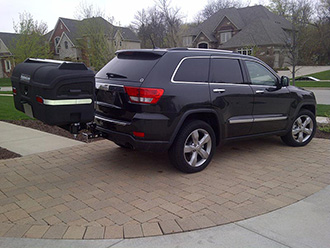 Audi Quattro with StowAway MAX Cargo Carrier with Carrier Lid Rack on a dual-mount hitch