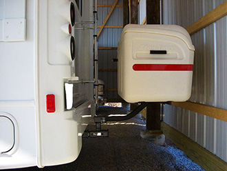 RV with white StowAway MAX Cargo Carrier mounted on dual-hitch receiver