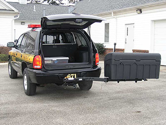 Police vehicle with liftgate open and StowAway Standard Carrier swung out