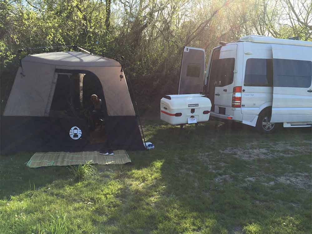 StowAway MAX Cargo Carrier on SwingAway frame at a campsite with tent