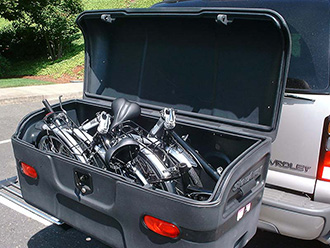 StowAway MAX Cargo Carrier on Chevy Suburban holding 2 folding bikes, open