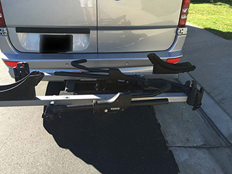StowAway SwingAway Frame on Mercedes Sprinter van with Thule wheel-mounted bike rack, empty, closed