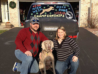 Wrigley and his owners in front of their StowAway MAX Cargo Carrier, on the way to the Dock Dogs World Championships