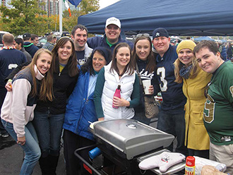 Notre Dame fans tailgating with StowAway Hitch Grill Station
