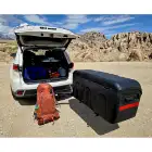 Stowaway Max Box on white SUV in desert.